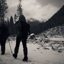 People standing on snow covered mountain