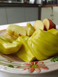 Close-up of fruits in plate on table