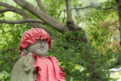 Close-up of statue against trees
