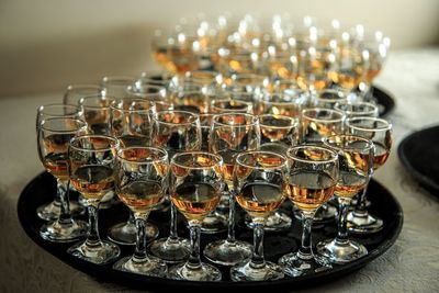 Close-up of wine glasses on table