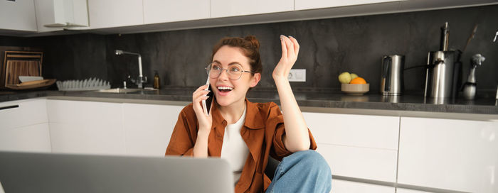 Young woman using phone