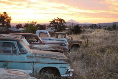 Abandoned car on field