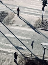 High angle view of man walking on street