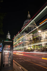 Light trails on street with st peters basilica in background at night