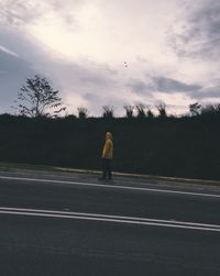 Rear view of man on road