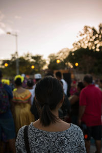 Rear view of woman standing on street