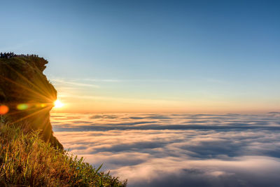 Scenic view of land against sky during sunset