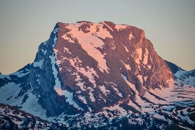 Scenic view of snowcapped mountains against clear sky