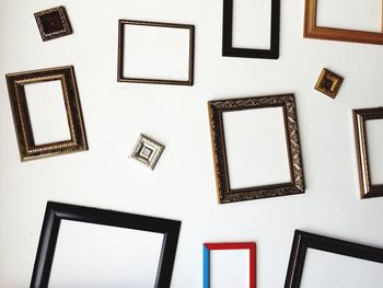 Picture frames on white wall