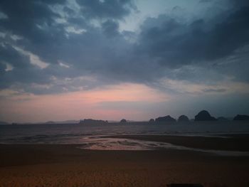 Scenic view of beach against sky during sunset