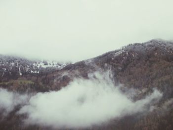 Scenic view of mountains in foggy weather