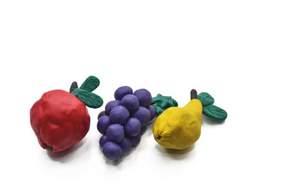 High angle view of multi colored candies against white background