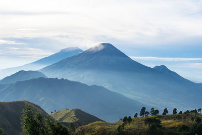 The view from the top of mount prau and the activities of the climbers near the camping tent