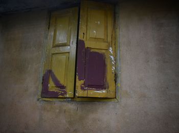 Close-up of open door of abandoned building