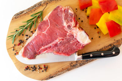 High angle view of meat on cutting board