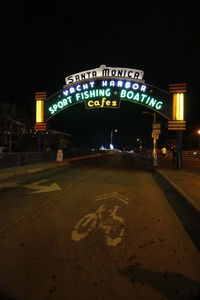 Information sign in city at night