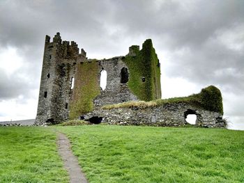 Low angle view of ballycarbery castle against sky