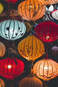 Low angle view of illuminated lanterns hanging in market