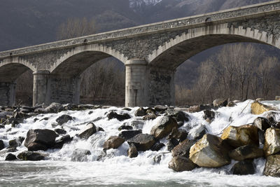 Arch bridge over river