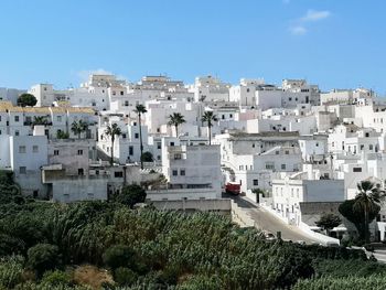 High angle view of townscape against blue sky