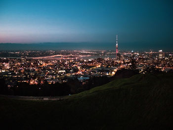 High angle view of illuminated buildings in city at night