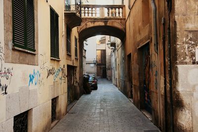 Archway amidst buildings in city