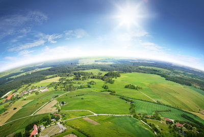 Scenic view of green landscape against sky