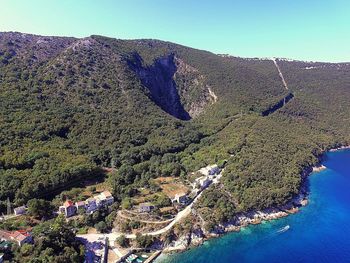 Aerial view of sea against clear sky
