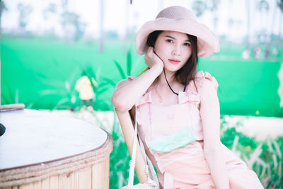 Portrait of beautiful young woman standing outdoors