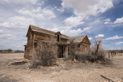 House on field against sky