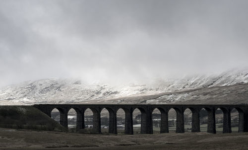 Aqueduct at ribblehead against sky