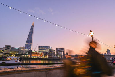 View of suspension bridge against sky during sunset