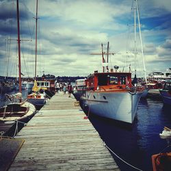 Boats moored at harbor