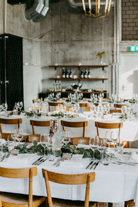 High angle view of empty chairs and tables in restaurant