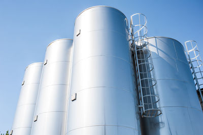 Low angle view of factory against sky