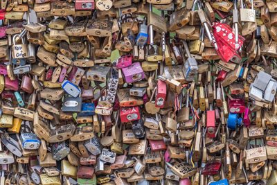 Close-up of padlocks hanging on railing