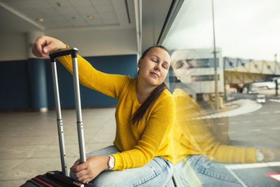 Young woman smiling while sitting in bus