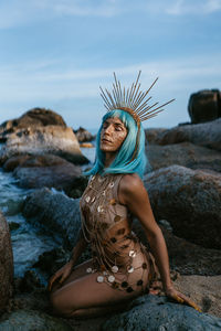 Young girl in gold on the beach