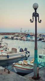 Boats moored at harbor