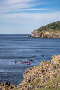 Kayakers at hammeren harbour, bornholm, denmark