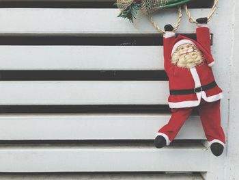 Close-up of christmas decorations hanging against blurred background