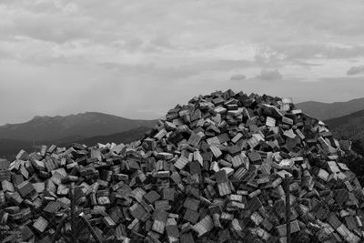 Stack of stones on mountain against sky