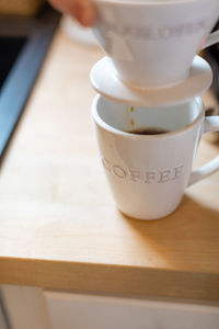 Close-up of coffee cup on table