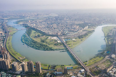 High angle view of river amidst buildings in city