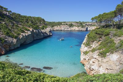 Scenic view of sea against clear blue sky