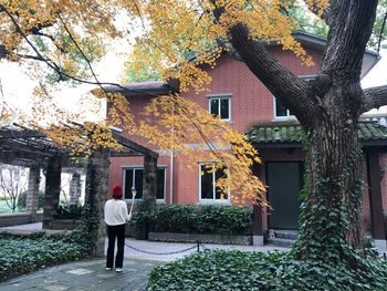 Rear view of man outside building