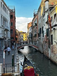 Boats in canal in city