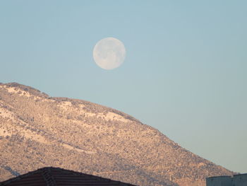 Low angle view of moon against clear sky