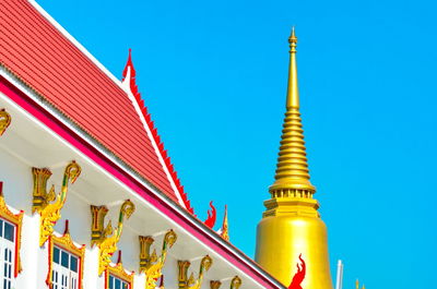 Low angle view of traditional building against clear blue sky