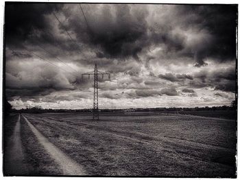 Scenic view of landscape against cloudy sky